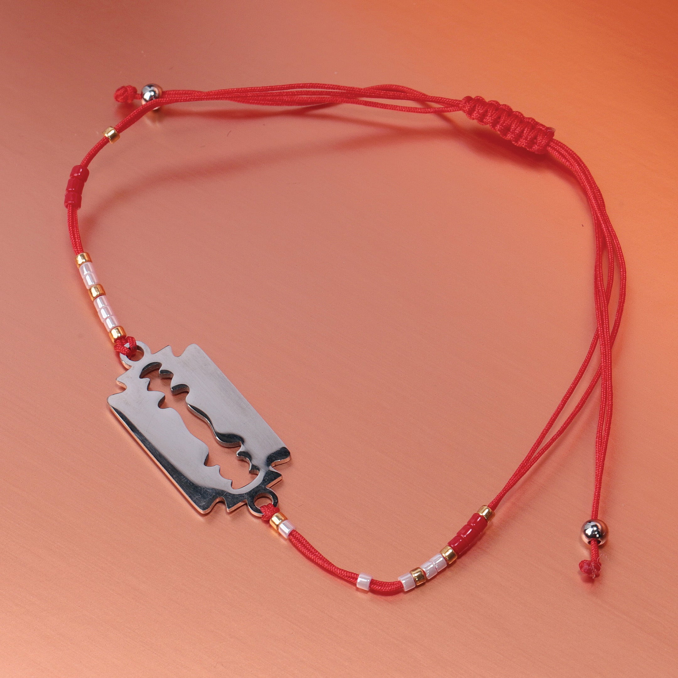 Razor Charm Red Braided Bracelet