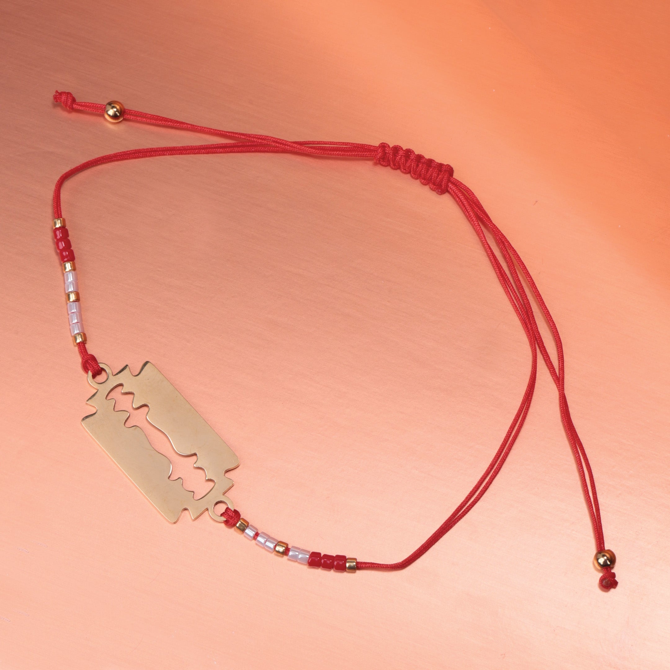 Razor Charm Red Braided Bracelet
